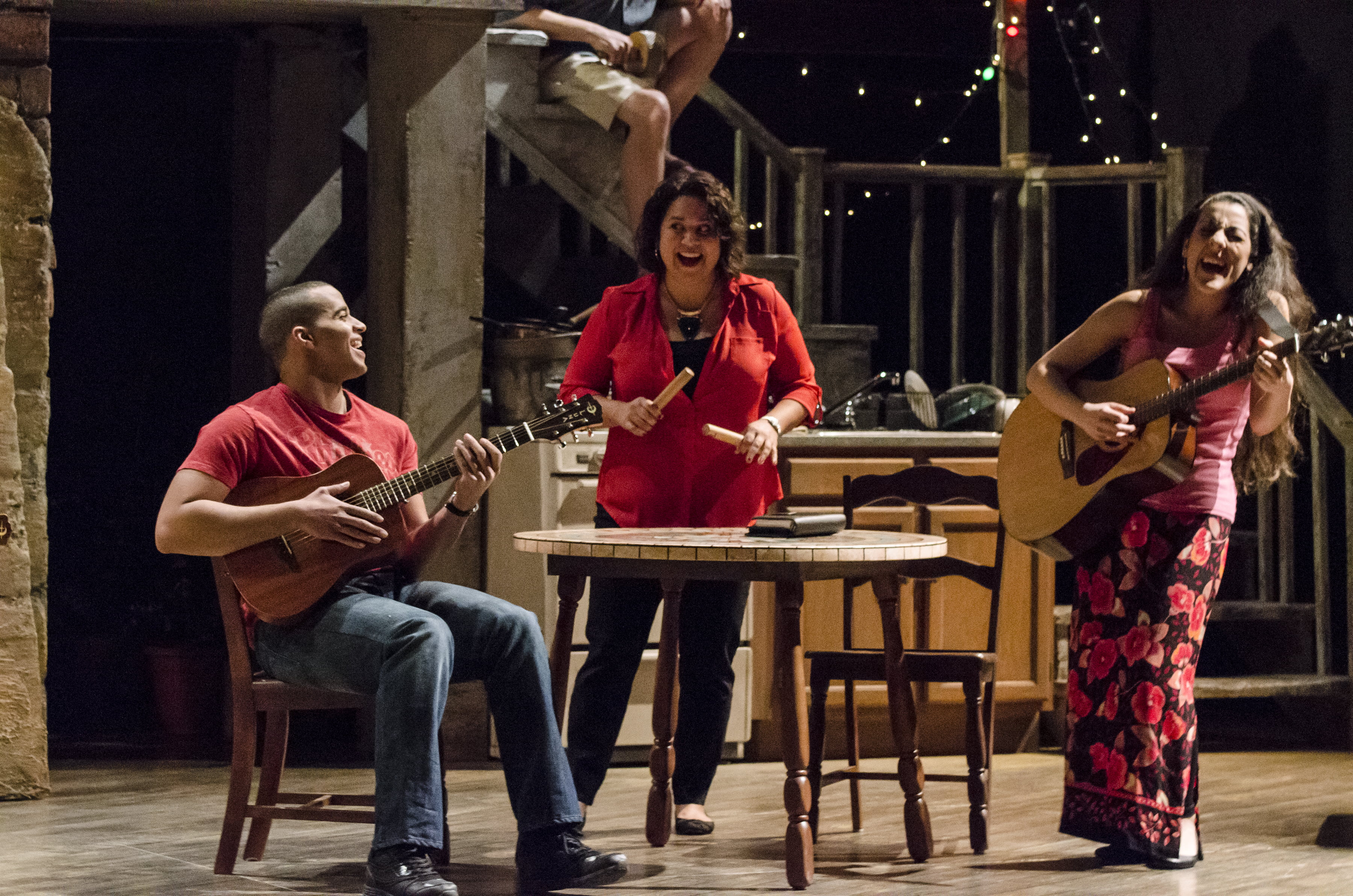 The cast of The Happiest Song Plays Last perform a lively and fun musical number on stage at the Curious Theatre.