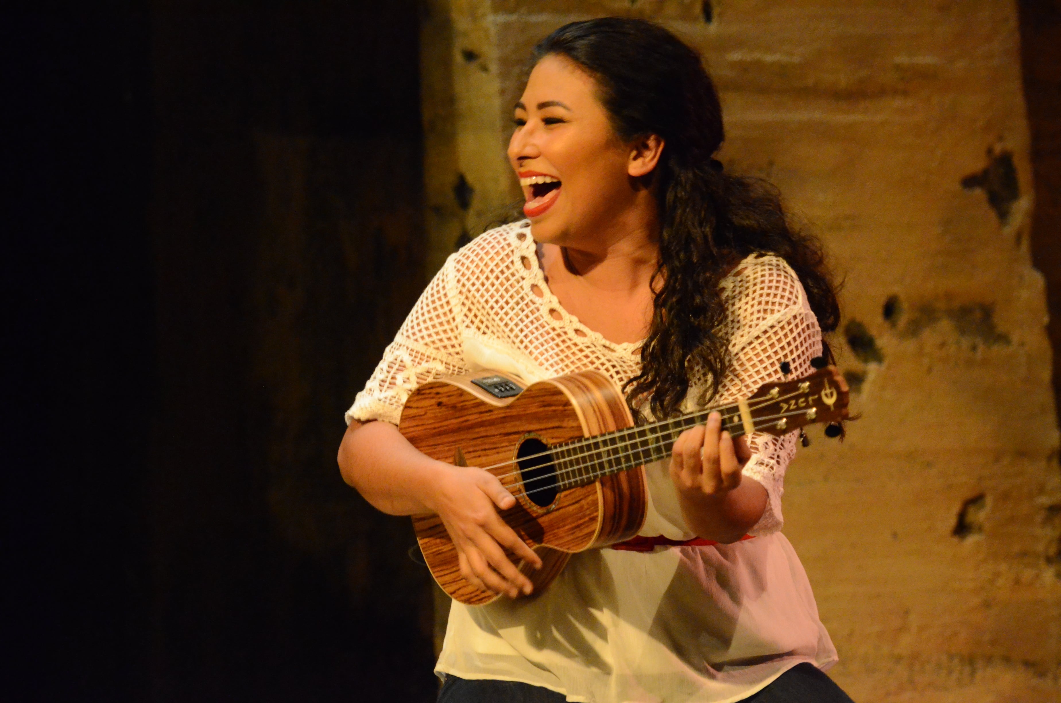 The cast of The Happiest Song Plays Last perform a lively and fun musical number on stage at the Curious Theatre.