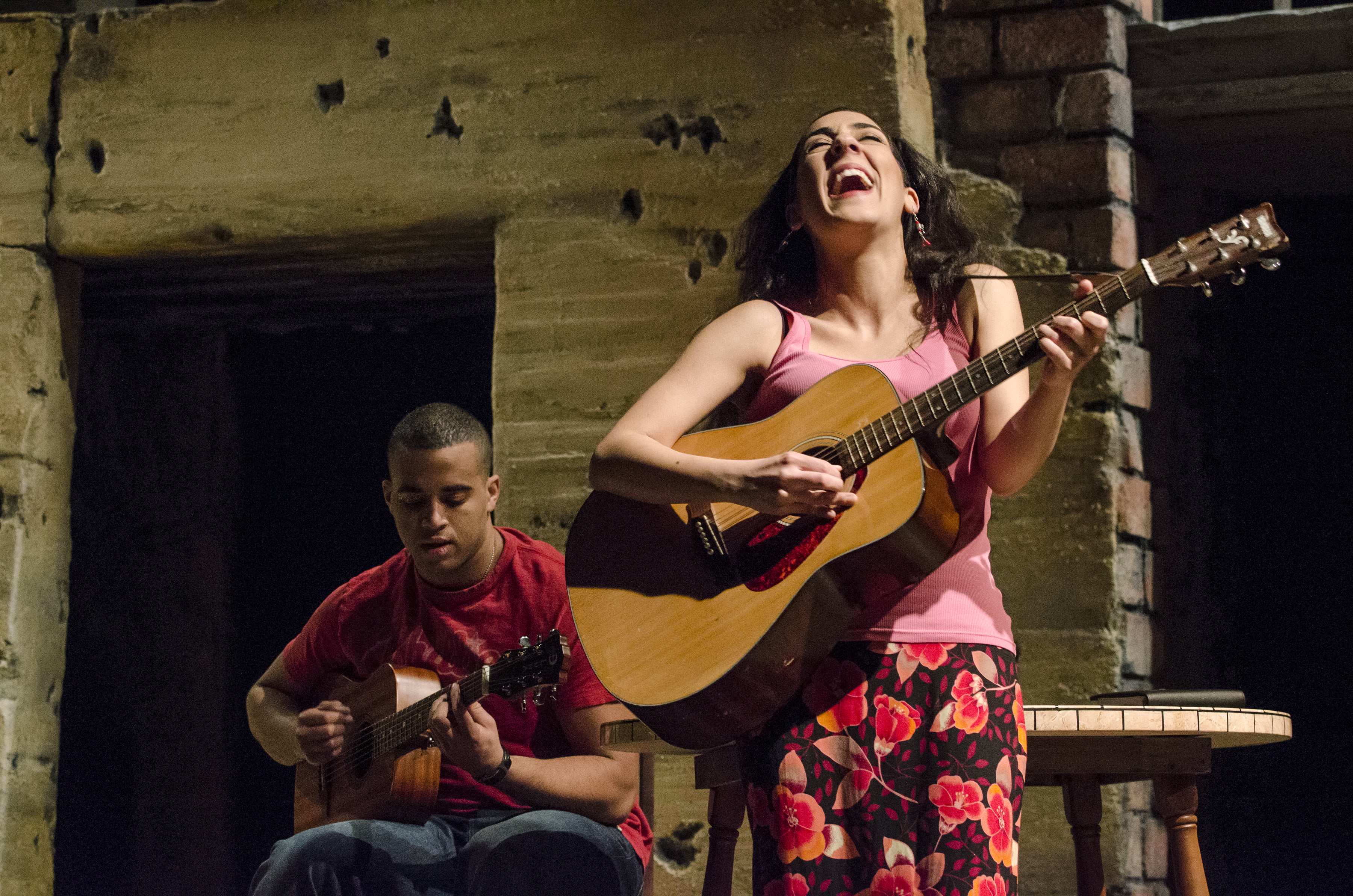 The cast of The Happiest Song Plays Last perform a lively and fun musical number on stage at the Curious Theatre.